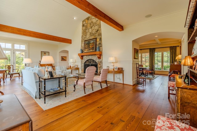 650 Golf Course Rd, Columbus, NC 28722 - living area featuring arched walkways, a fireplace, and hardwood / wood-style flooring