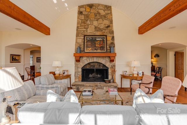 650 Golf Course Rd, Columbus, NC 28722 - living area with arched walkways, wood finished floors, a wainscoted wall, and a fireplace
