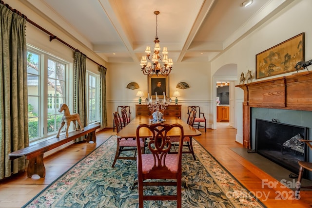 650 Golf Course Rd, Columbus, NC 28722 - dining room with arched walkways, beamed ceiling, light wood finished floors, coffered ceiling, and a fireplace