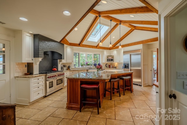 650 Golf Course Rd, Columbus, NC 28722 - kitchen featuring high end appliances, a skylight, light stone countertops, white cabinetry, and recessed lighting