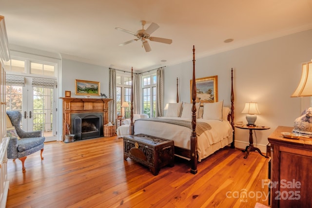 650 Golf Course Rd, Columbus, NC 28722 - bedroom featuring access to exterior, light wood-style floors, ornamental molding, a fireplace, and a ceiling fan