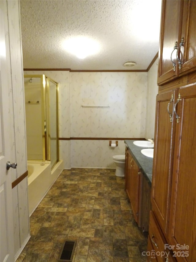113 Dillon St, Winston Salem, NC 27107 - bathroom featuring ornamental molding, a shower with door, a bath, stone finish flooring, and vanity