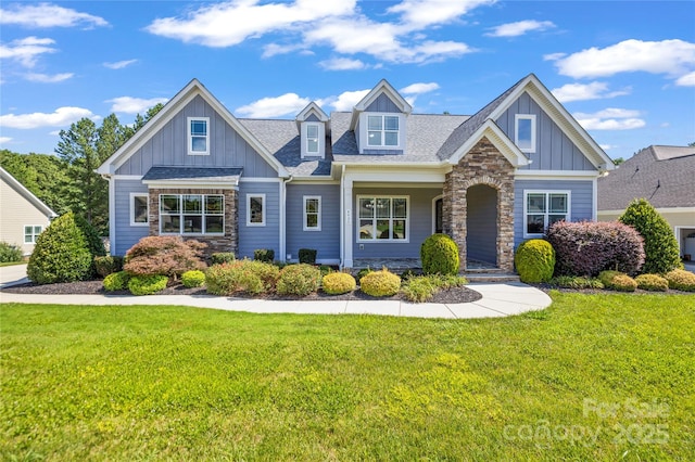 4930 Killian Crossing Dr, Denver, NC 28037 - craftsman-style home featuring stone siding, board and batten siding, and a front lawn