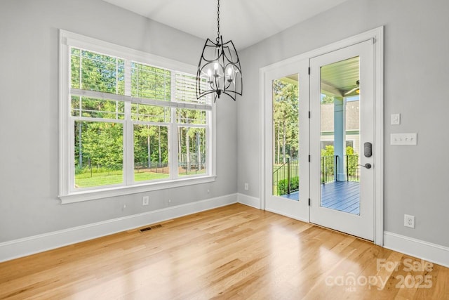 4930 Killian Crossing Dr, Denver, NC 28037 - unfurnished dining area featuring a chandelier and wood finished floors