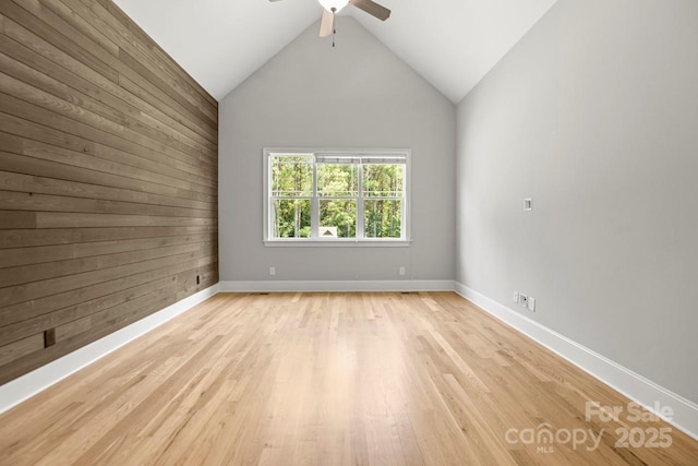 4930 Killian Crossing Dr, Denver, NC 28037 - spare room featuring wood walls, a ceiling fan, light wood-style flooring, and lofted ceiling