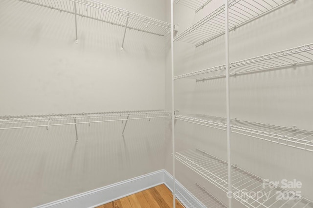 4930 Killian Crossing Dr, Denver, NC 28037 - walk in closet featuring wood finished floors
