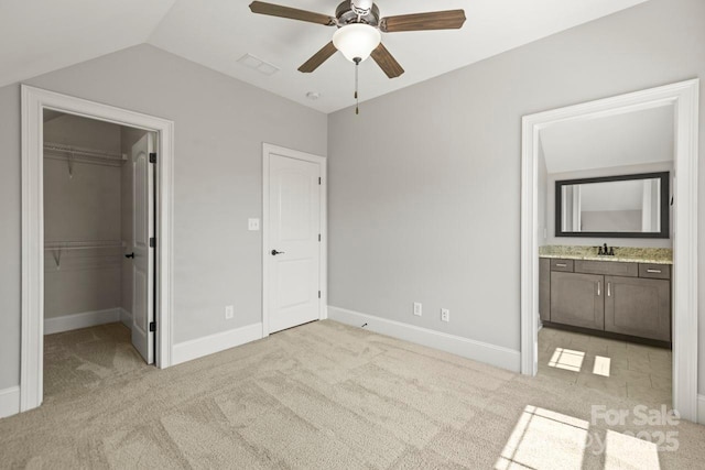 4930 Killian Crossing Dr, Denver, NC 28037 - unfurnished bedroom with light colored carpet, a spacious closet, vaulted ceiling, connected bathroom, and a closet