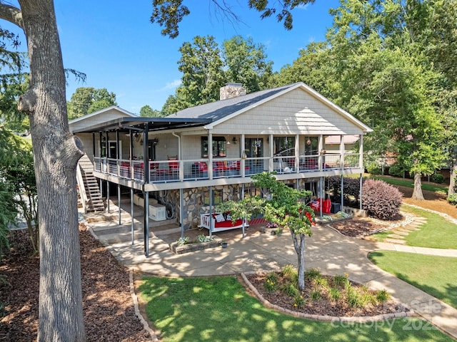 643 Lake Dr Unit 10, Lexington, NC 27292 - view of front of property featuring a patio area, a chimney, and stairs