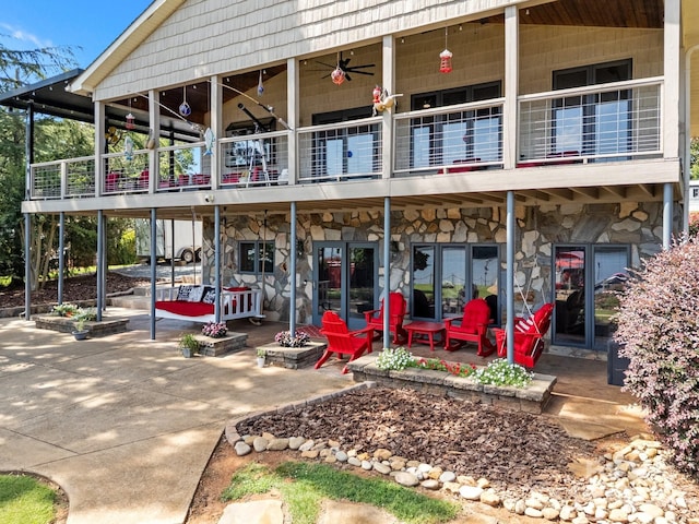 643 Lake Dr Unit 10, Lexington, NC 27292 - property entrance with a balcony, stone siding, a patio, and a ceiling fan