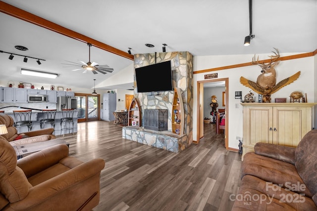 643 Lake Dr Unit 10, Lexington, NC 27292 - living area featuring track lighting, wood finished floors, a fireplace, and a ceiling fan