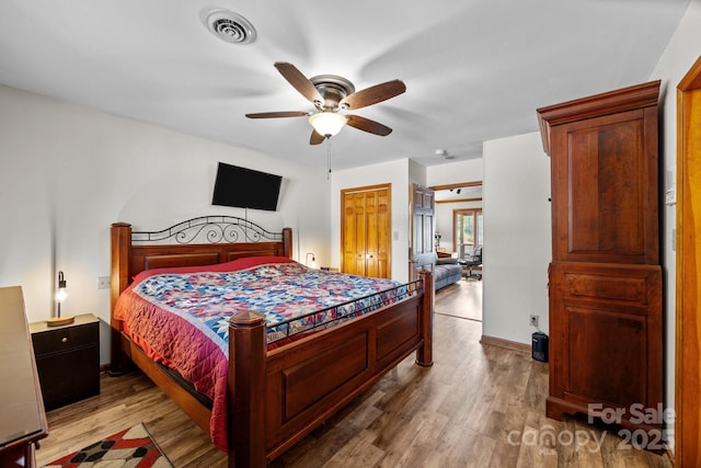 643 Lake Dr Unit 10, Lexington, NC 27292 - bedroom featuring wood finished floors, a closet, and a ceiling fan