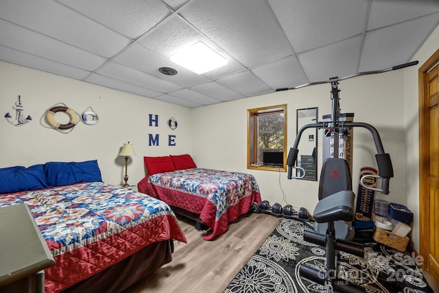643 Lake Dr Unit 10, Lexington, NC 27292 - bedroom with wood finished floors and a paneled ceiling