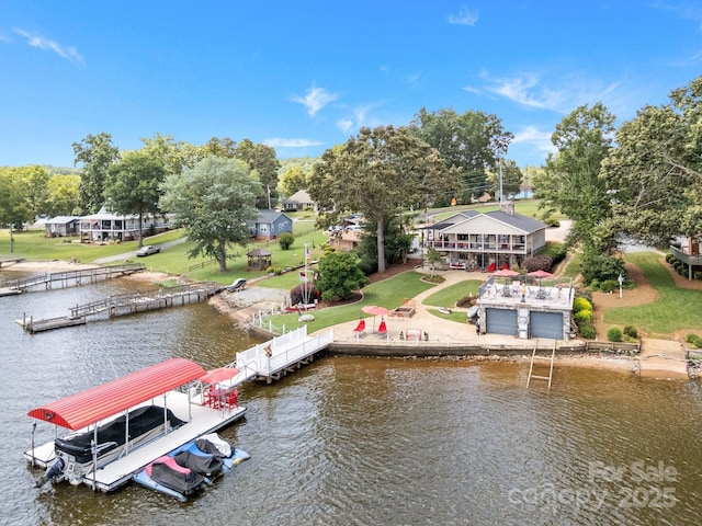 643 Lake Dr Unit 10, Lexington, NC 27292 - dock area featuring a water view, view of wooded area, boat lift, and a lawn