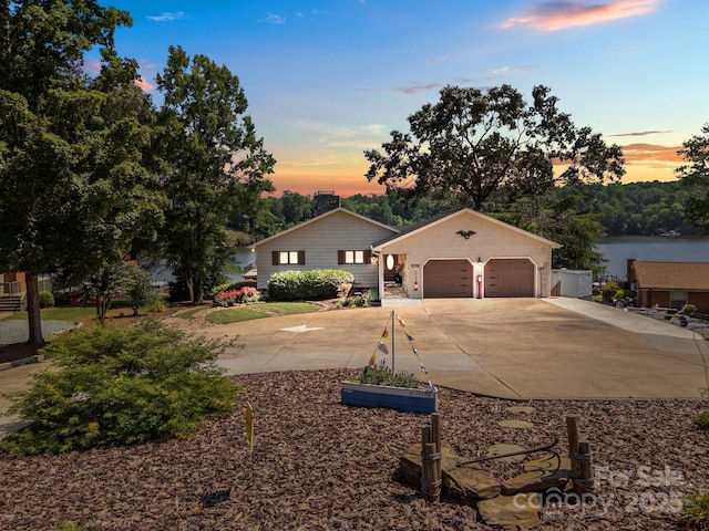643 Lake Dr Unit 10, Lexington, NC 27292 - view of front of home with driveway, an attached garage, and a chimney