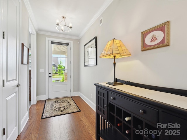 10305 Superb Ln, Charlotte, NC 28215 - foyer entrance featuring a chandelier, wood finished floors, and crown molding