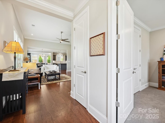 10305 Superb Ln, Charlotte, NC 28215 - hall featuring dark wood-style flooring, crown molding, and a chandelier