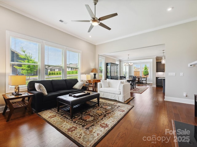 10305 Superb Ln, Charlotte, NC 28215 - living room with ornamental molding, a chandelier, a ceiling fan, dark wood-style flooring, and recessed lighting