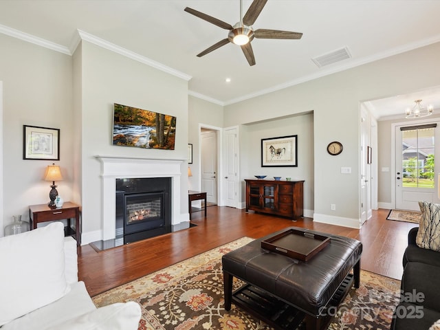 10305 Superb Ln, Charlotte, NC 28215 - living room with wood finished floors, ceiling fan, crown molding, a fireplace with flush hearth, and recessed lighting