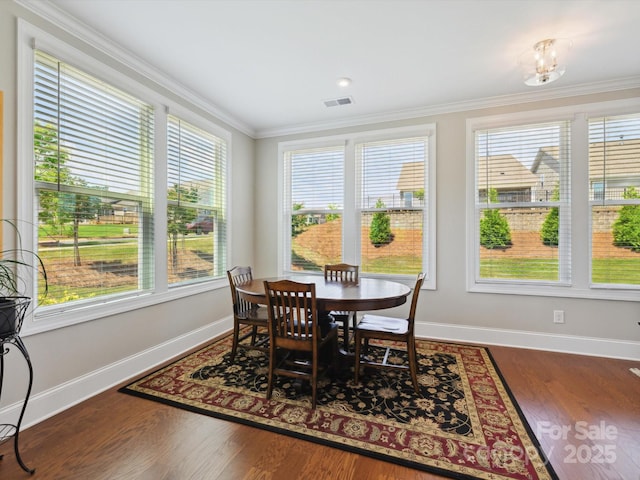 10305 Superb Ln, Charlotte, NC 28215 - dining space with plenty of natural light, crown molding, and wood finished floors