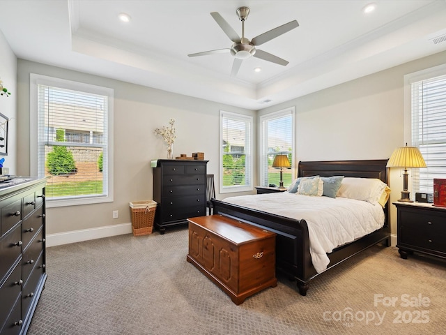 10305 Superb Ln, Charlotte, NC 28215 - bedroom with a raised ceiling, light colored carpet, multiple windows, recessed lighting, and a ceiling fan