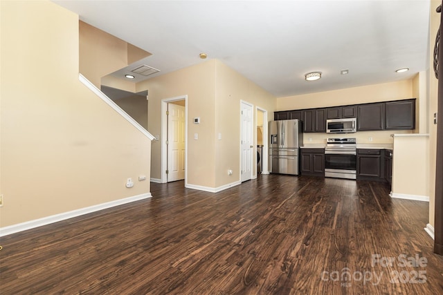 4208 Carl Parmer Dr, Harrisburg, NC 28075 - kitchen featuring stainless steel appliances, dark wood-type flooring, light countertops, and dark brown cabinetry