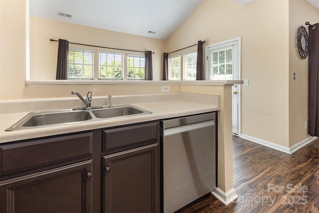 4208 Carl Parmer Dr, Harrisburg, NC 28075 - kitchen with stainless steel dishwasher, dark brown cabinetry, lofted ceiling, dark wood-style floors, and light countertops