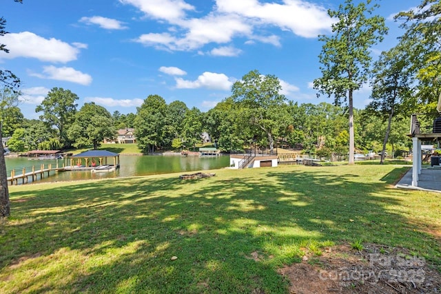 172 Honeydew Cir, Troutman, NC 28166 - view of grassy yard featuring a water view, a dock, and view of wooded area