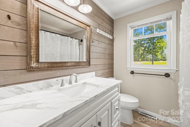 172 Honeydew Cir, Troutman, NC 28166 - full bathroom with crown molding, vanity, wooden walls, and wood finished floors