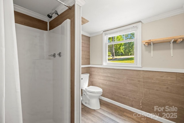 172 Honeydew Cir, Troutman, NC 28166 - bathroom featuring a stall shower, wood finished floors, and ornamental molding