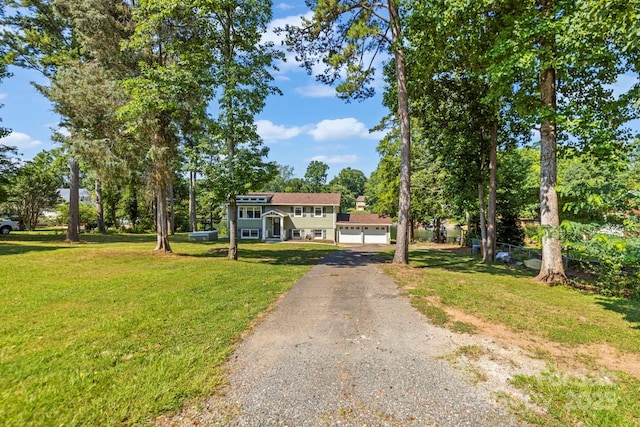 172 Honeydew Cir, Troutman, NC 28166 - view of front of property with driveway, a front yard, and a garage