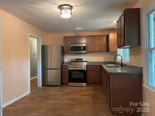 1320 Kings Cir, Shelby, NC 28150 - kitchen with appliances with stainless steel finishes and dark stone countertops