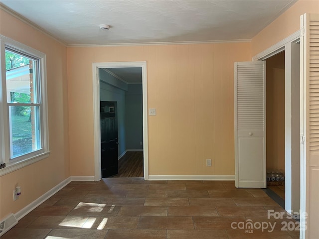 1320 Kings Cir, Shelby, NC 28150 - unfurnished bedroom with crown molding and a closet