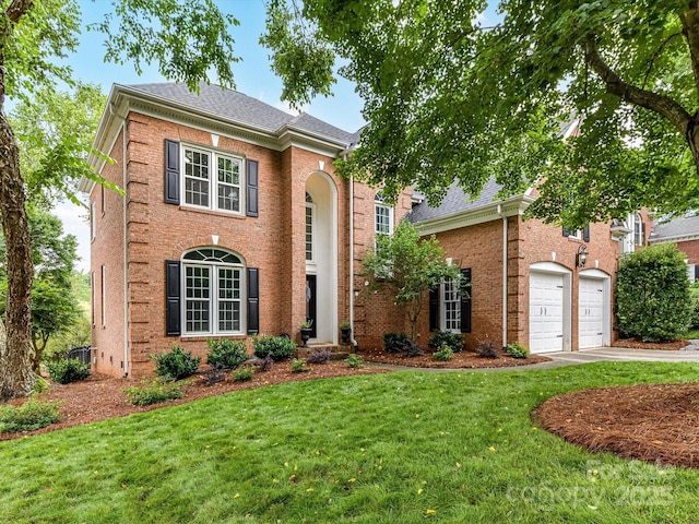 4032 Cambridge Hill Ln, Charlotte, NC 28270 - view of front of home featuring concrete driveway, a front yard, brick siding, and a shingled roof