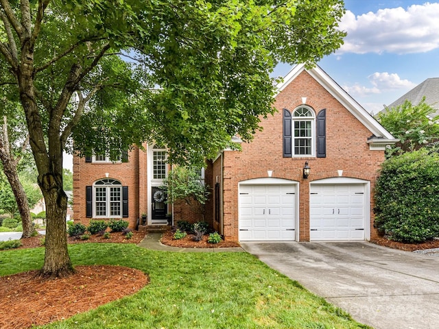4032 Cambridge Hill Ln, Charlotte, NC 28270 - view of front of property with driveway, a front yard, a garage, and brick siding