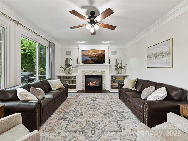 4032 Cambridge Hill Ln, Charlotte, NC 28270 - living room with crown molding, a ceiling fan, a fireplace, and wood finished floors