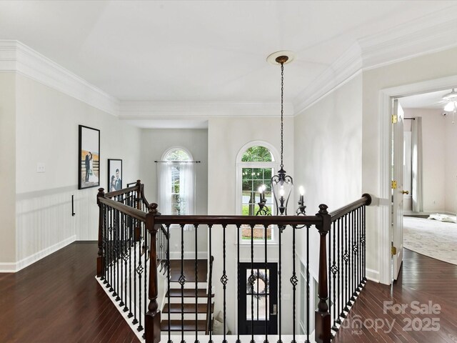 4032 Cambridge Hill Ln, Charlotte, NC 28270 - hallway with an upstairs landing, a chandelier, wood finished floors, and ornamental molding