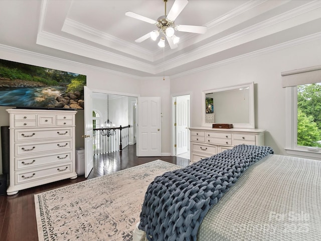 4032 Cambridge Hill Ln, Charlotte, NC 28270 - bedroom with dark wood-style flooring, ornamental molding, a tray ceiling, a ceiling fan, and a chandelier