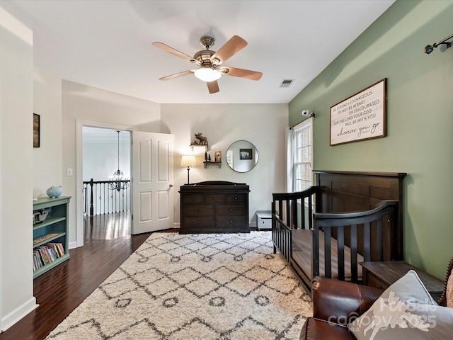 4032 Cambridge Hill Ln, Charlotte, NC 28270 - bedroom with wood finished floors, a chandelier, and a ceiling fan