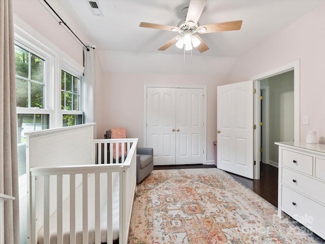 4032 Cambridge Hill Ln, Charlotte, NC 28270 - bedroom with wood finished floors, a closet, lofted ceiling, a ceiling fan, and a crib
