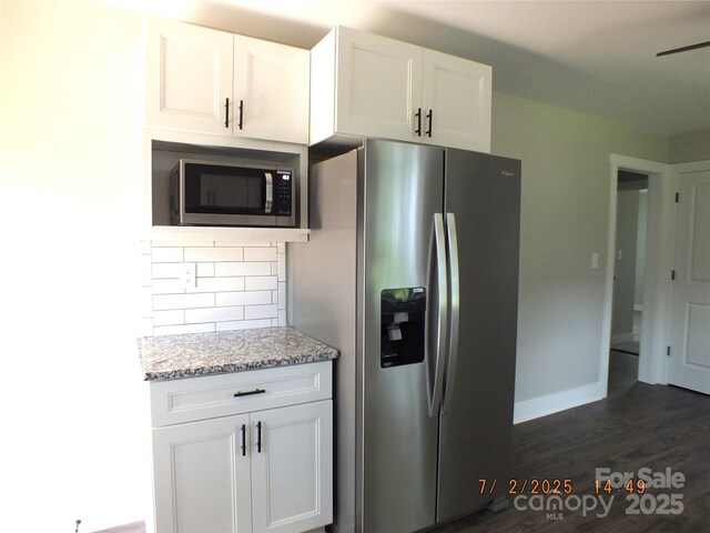 1732 Rocky River Rd, Lancaster, SC 29720 - kitchen with appliances with stainless steel finishes, backsplash, white cabinets, light stone counters, and dark wood-style floors