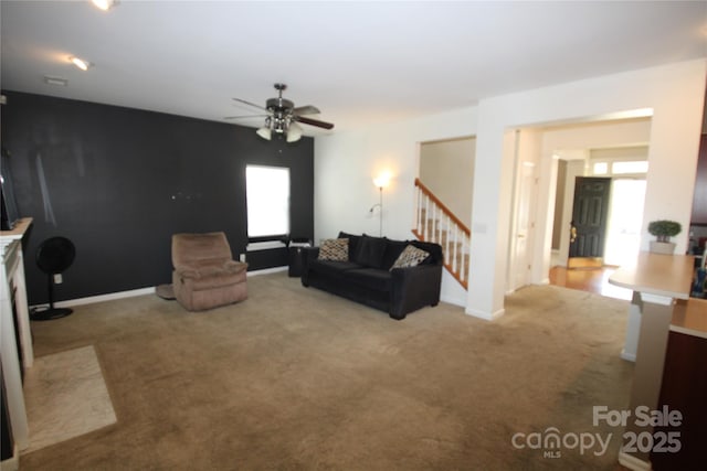 2418 Alaqua Ct, Matthews, NC 28105 - carpeted living area with stairway and a ceiling fan
