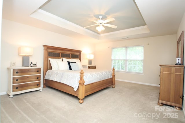 2418 Alaqua Ct, Matthews, NC 28105 - bedroom with a tray ceiling, light carpet, and ceiling fan