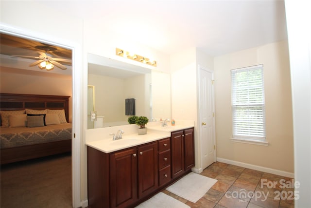 2418 Alaqua Ct, Matthews, NC 28105 - ensuite bathroom with double vanity and a ceiling fan