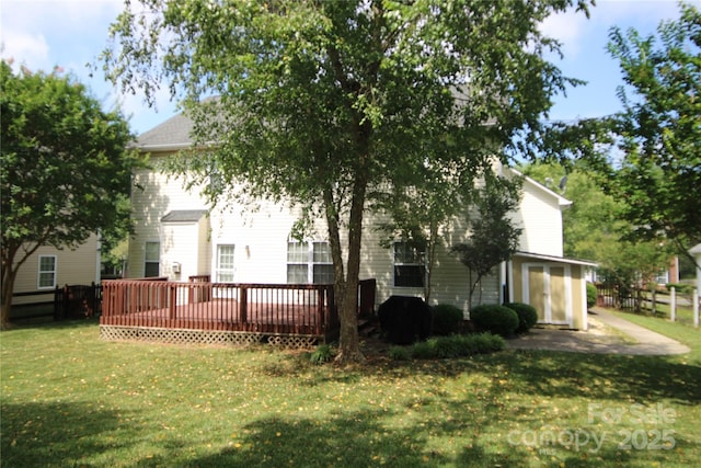 2418 Alaqua Ct, Matthews, NC 28105 - rear view of house with a deck and a lawn