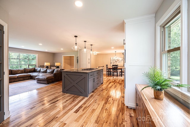 221 Roberts Ln, Lenoir, NC 28645 - kitchen featuring gray cabinetry, light wood-style flooring, stainless steel gas cooktop, decorative light fixtures, and recessed lighting