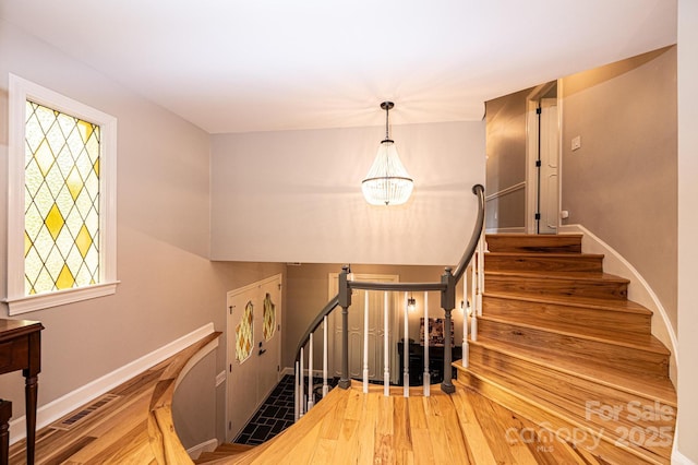 221 Roberts Ln, Lenoir, NC 28645 - staircase with plenty of natural light and wood finished floors