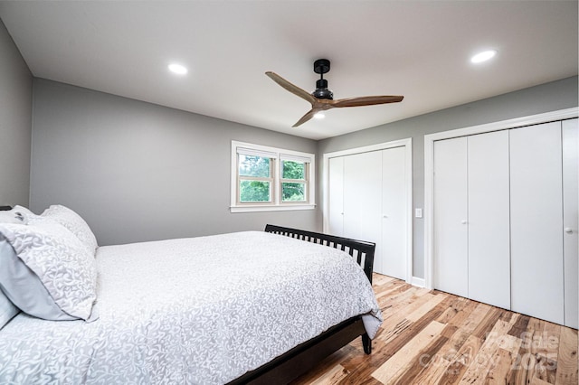 221 Roberts Ln, Lenoir, NC 28645 - bedroom featuring multiple closets, wood finished floors, recessed lighting, and a ceiling fan