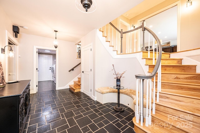 221 Roberts Ln, Lenoir, NC 28645 - stairway featuring washer and dryer and baseboards