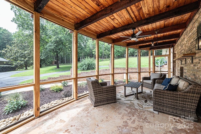 221 Roberts Ln, Lenoir, NC 28645 - sunroom / solarium featuring a ceiling fan, an outdoor hangout area, beam ceiling, and view of wooded area