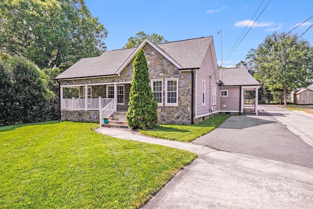 1004 Venus St, Kannapolis, NC 28083 - view of front of house featuring stone siding, a porch, a shingled roof, a front lawn, and asphalt driveway